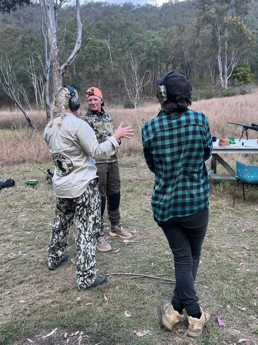 Women learning practical firearms skills together at a Women Who Hunt event.