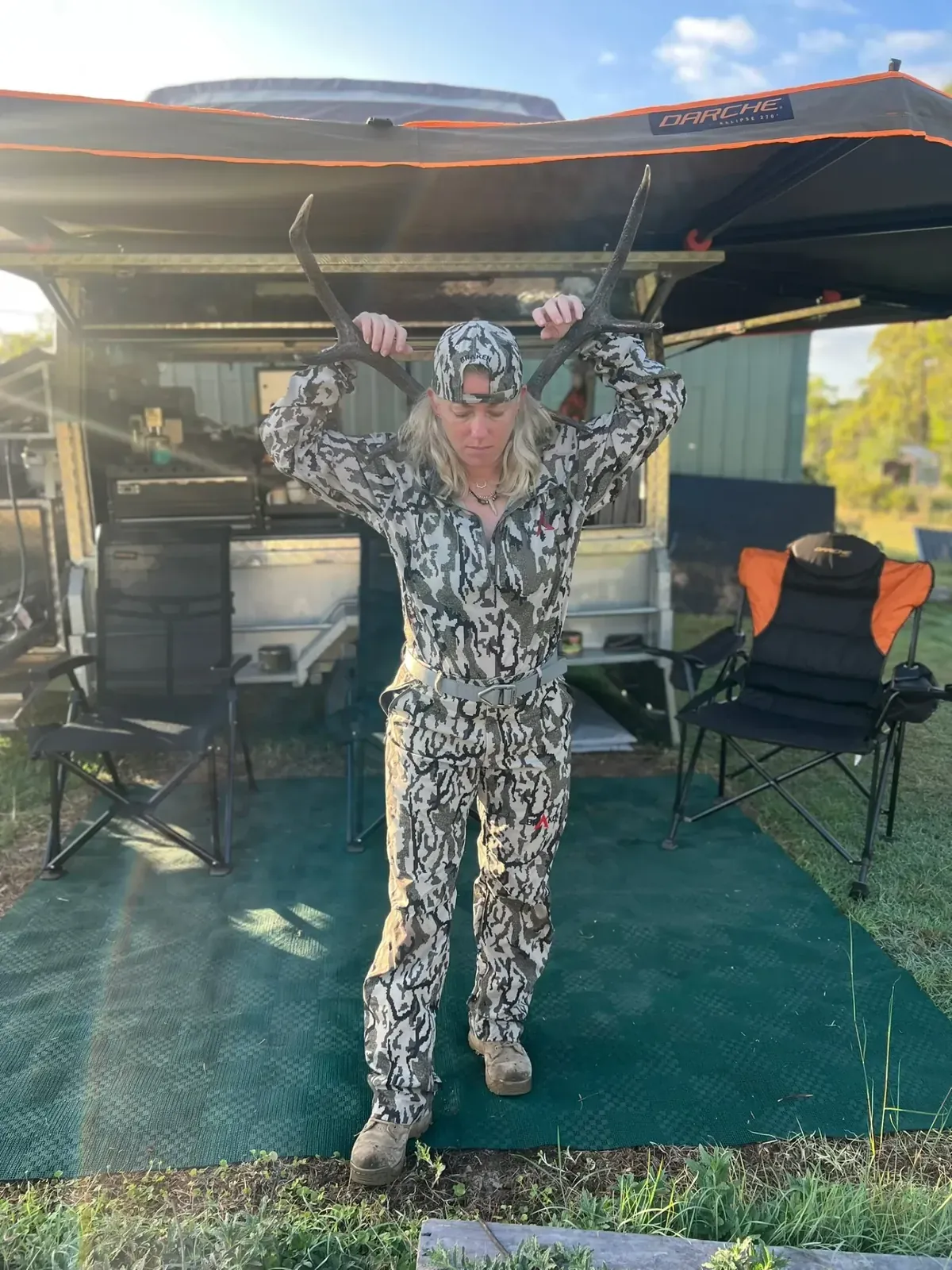 An Australian woman in golden bushland at sunrise — Women Who Hunt community